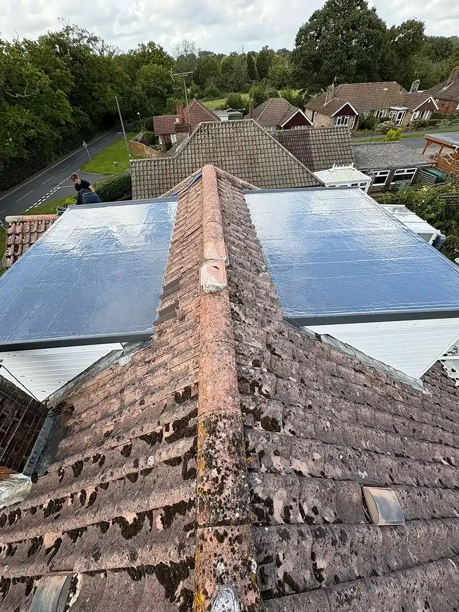 A roof with a flat roof on top of it.