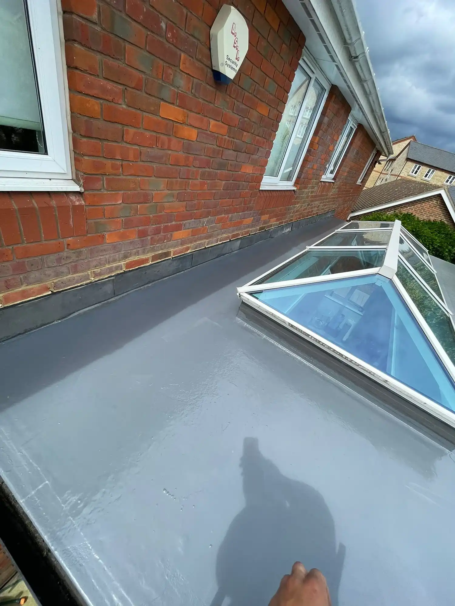 Flat roof with a skylight.