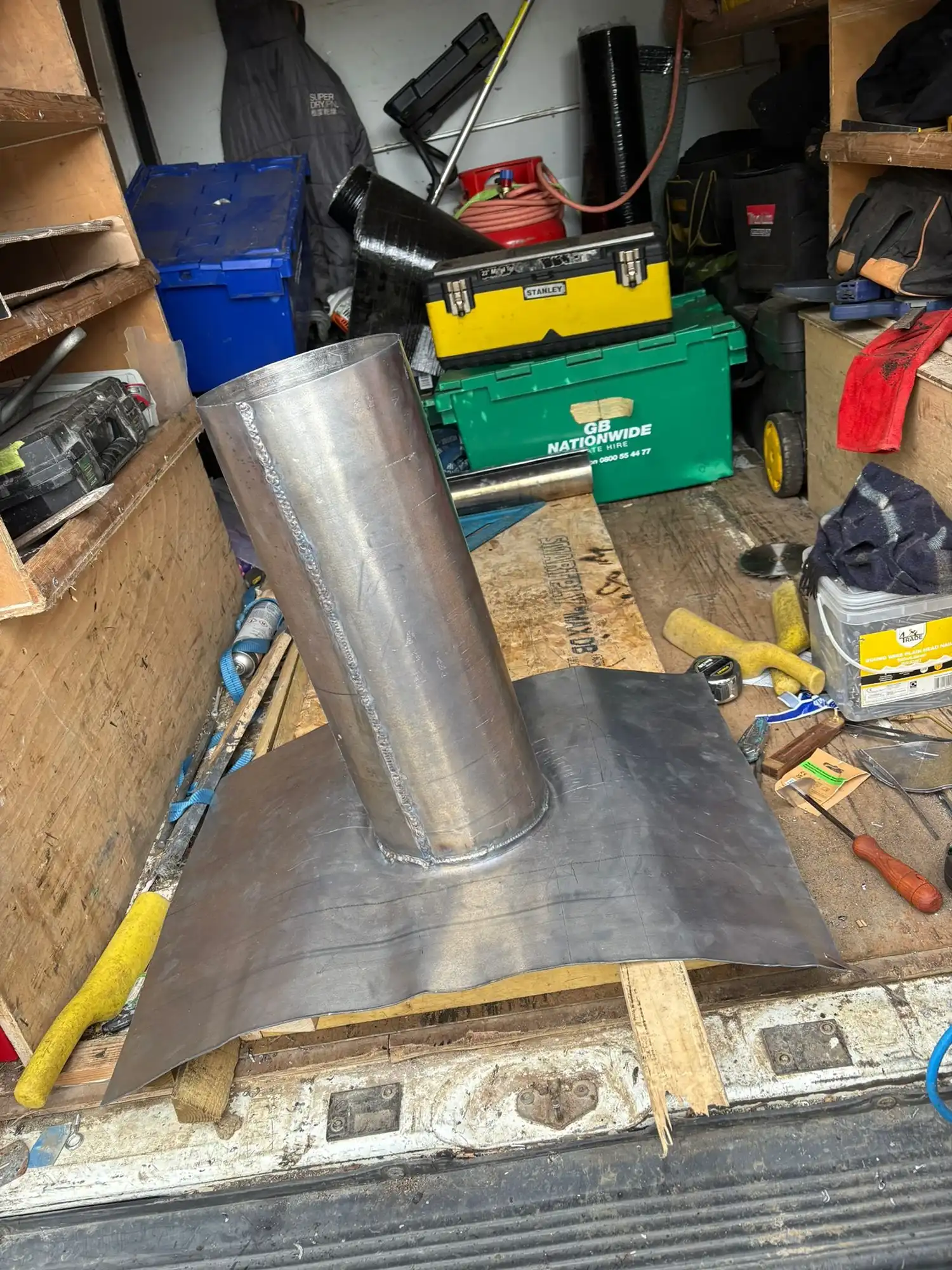 Metal chimney pot.