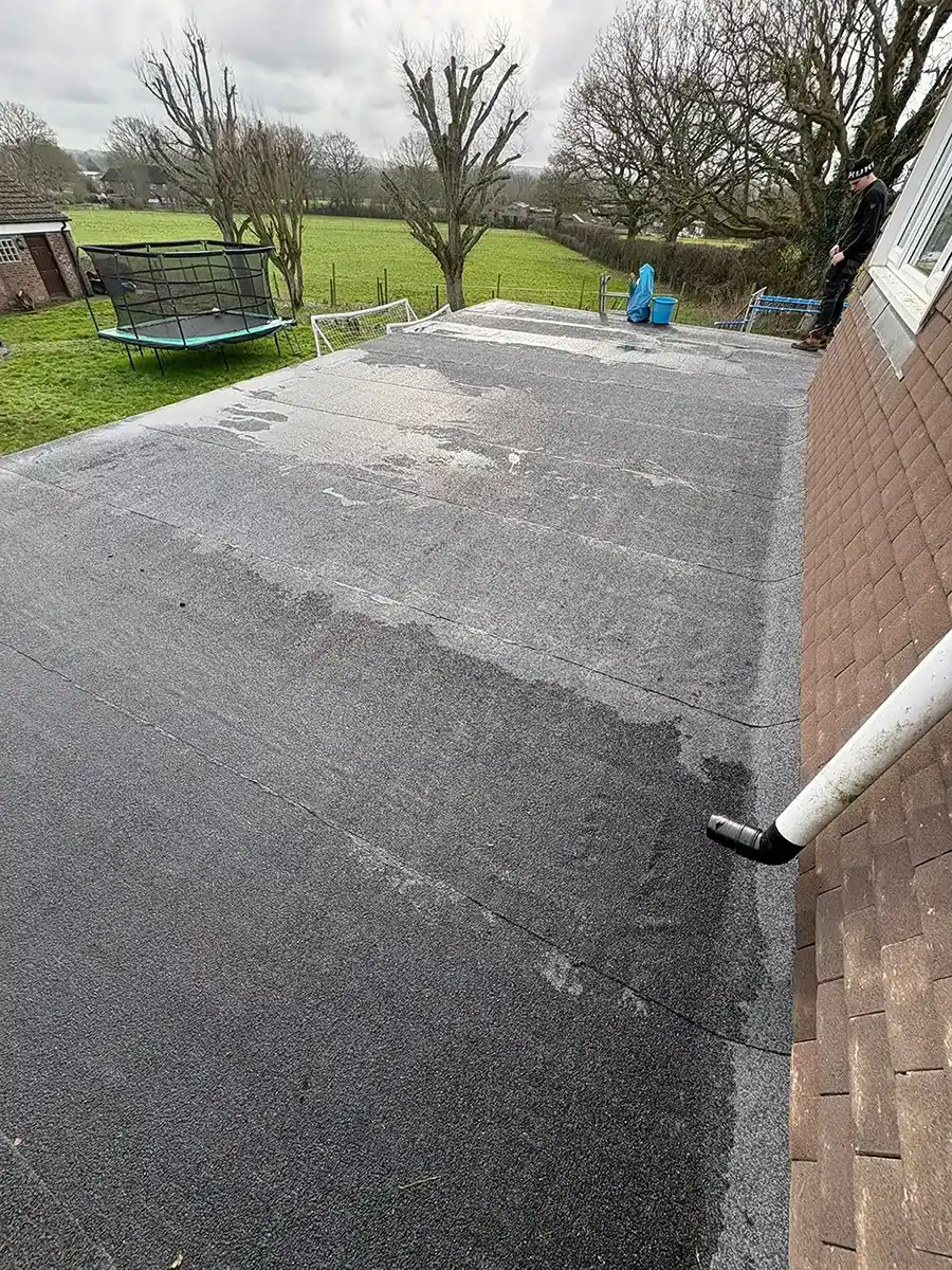 A flat roof is being installed on a house.